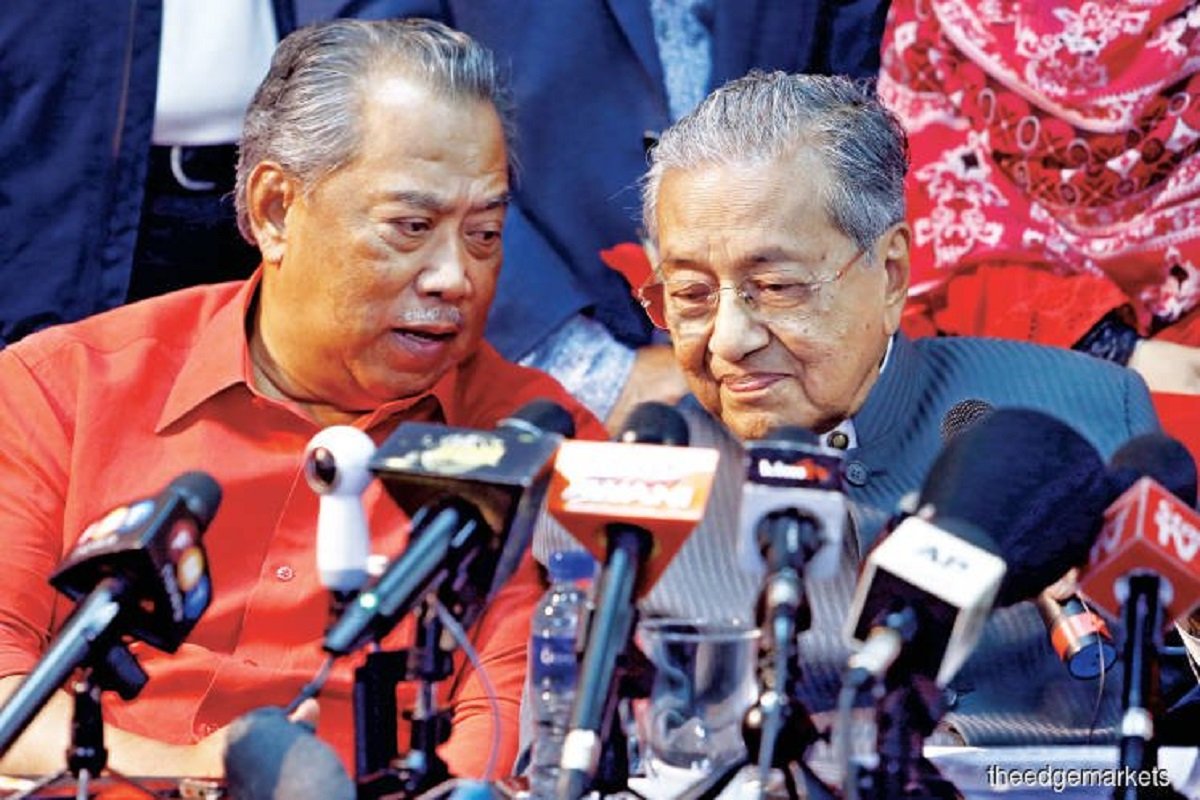 Tun Dr Mahathir Mohamad (right) and Tan Sri Muhyiddin Yassin
